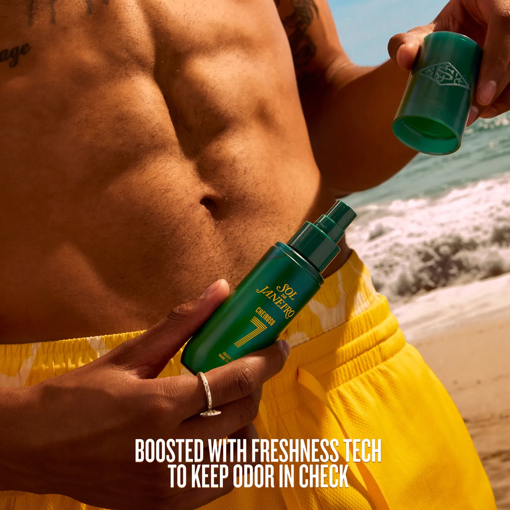 Person applying deodorant on a beach with text about freshness technology.