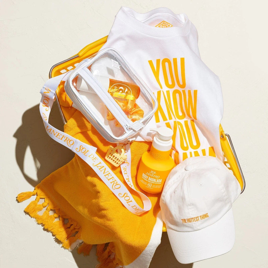 Sol de janeiro beach towel, t-shirt, crossbody bag and Badalada lotion all in asset